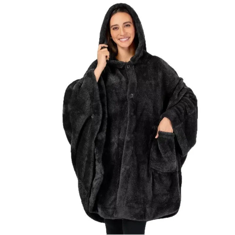 Thick pink hooded bathrobe with long sleeves and cardigan front on a hanger.