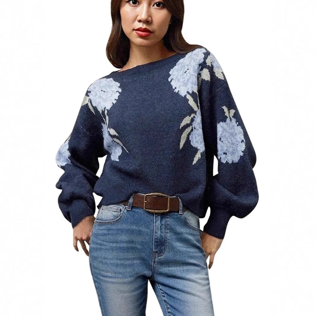 Sapphire blue women's loose pullover with a white floral jacquard pattern, off-neck design, and long sleeves.