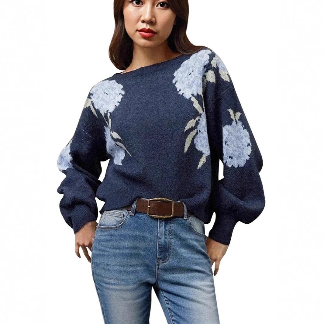 Sapphire blue women's loose pullover with a white floral jacquard pattern, off-neck design, and long sleeves.
