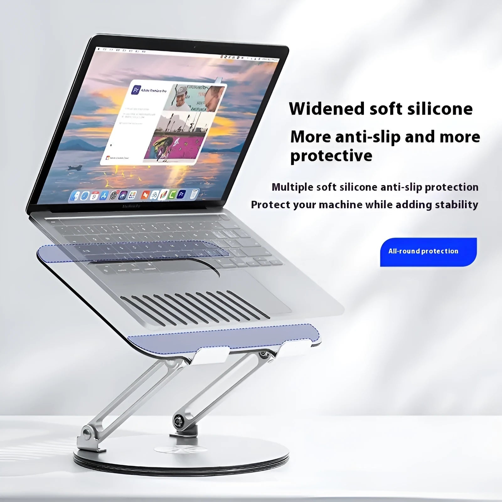 Silver aluminium alloy laptop stand with height adjustment and foldable design on desktop