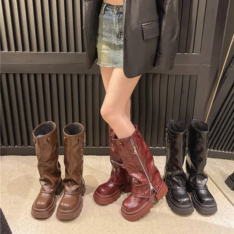 Platform muffin pants Martin boots in black with high cylinder socks and square rubber heels