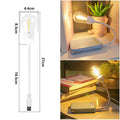 USB rechargeable folding night light with warm tungsten bulb illuminated.