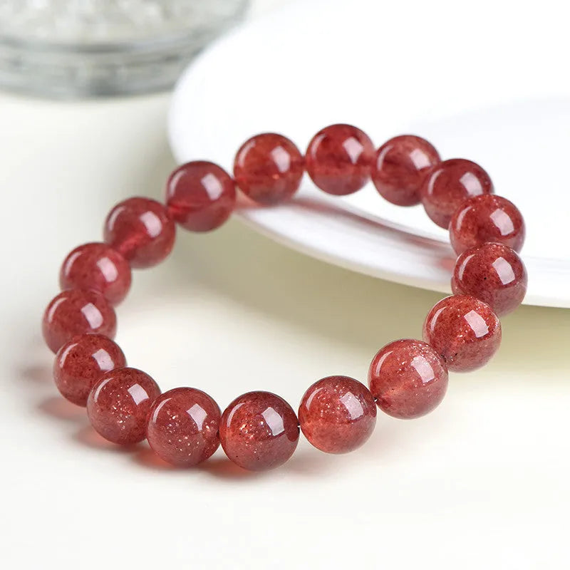 Strawberry quartz crystal bracelet with cherry red starlight colour and geometric beads