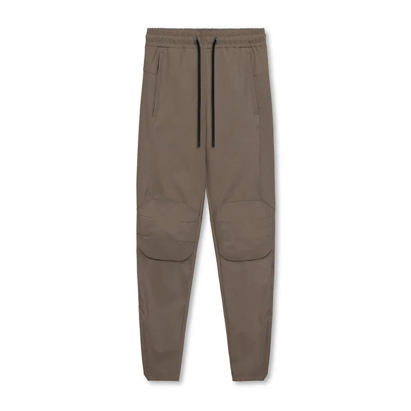 Men's grey quick-dry fitness trousers with ankle-tied design for gym workouts