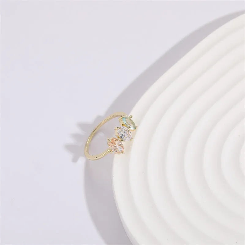 Geometric copper ring with a horse eye motif and tricolour zircon stone, electroplated in 14K Real Gold RG9066 colour.