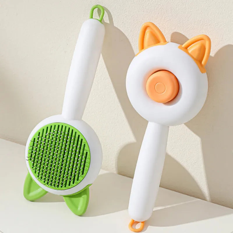 Self-cleaning pet dematting comb with stainless steel pins in greenish white and orange white colour options