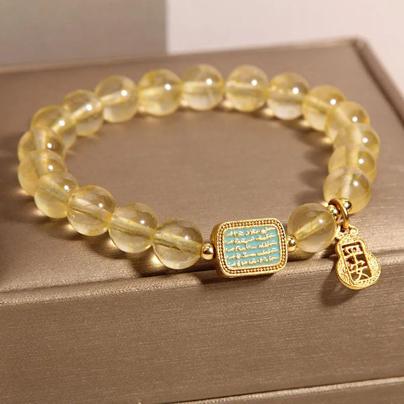 Women's yellow citrine crystal bracelet with rhinestone detailing and adjustable closure