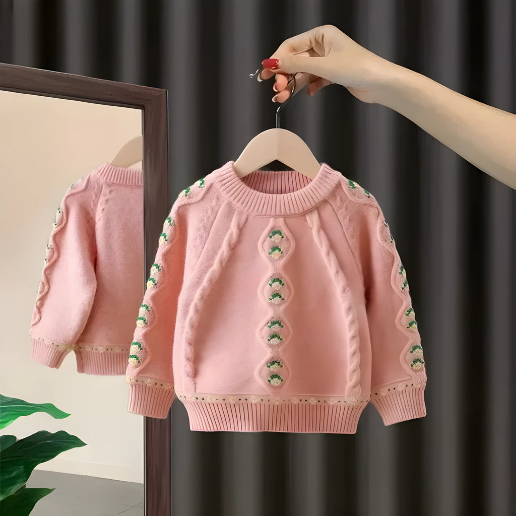 Girls pink knitted diamond flower pullover sweater with rabbit fur composition on white background