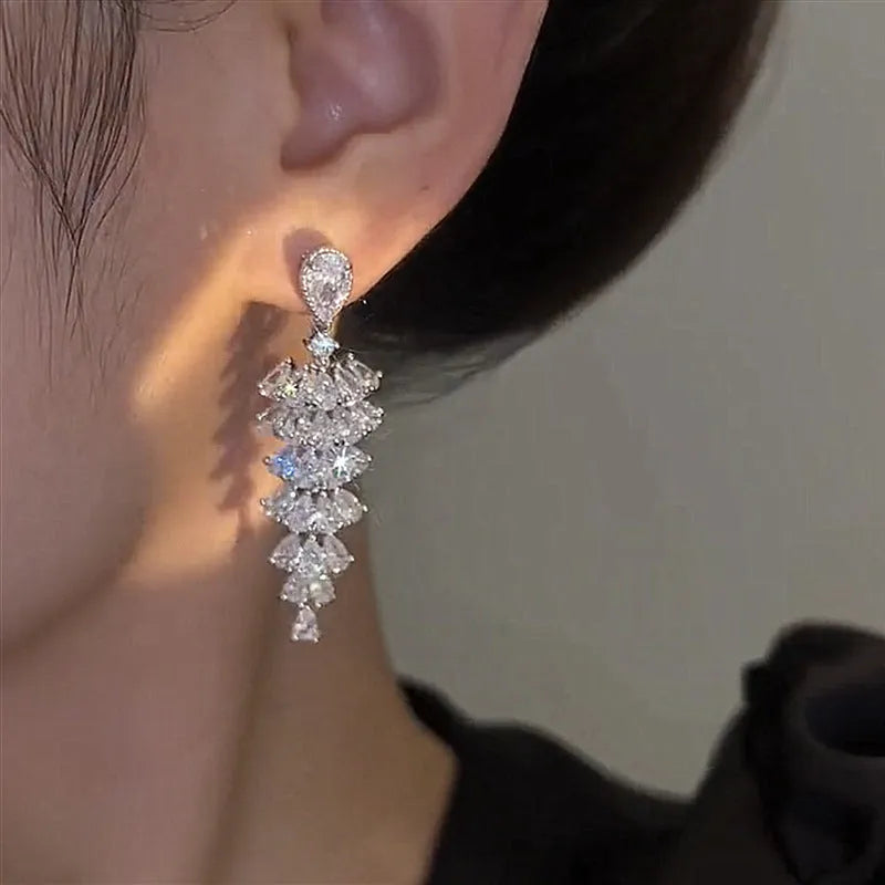 Silver pagoda Christmas tree drop earrings with sparkling zircon elements on copper construction