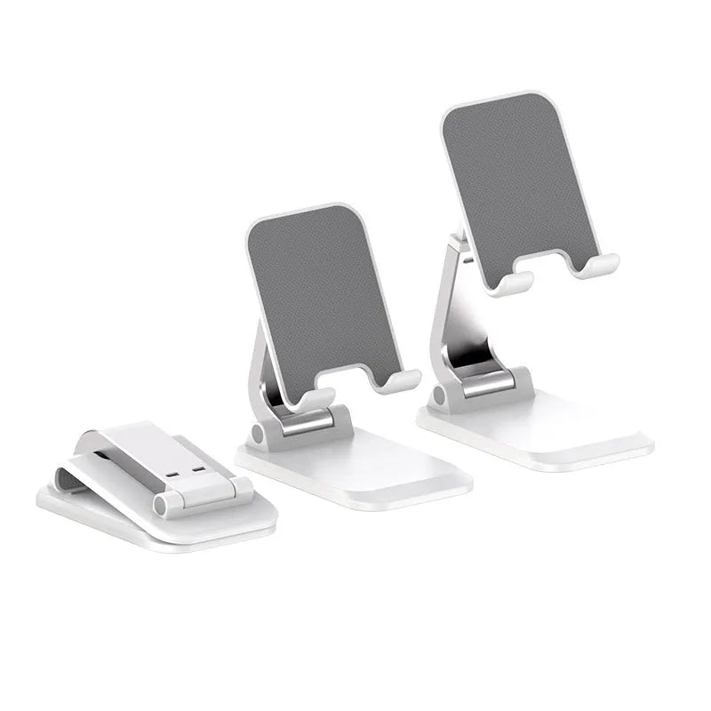 Folding portable desktop stand for mobile phones and tablets in white colour on a wooden desk