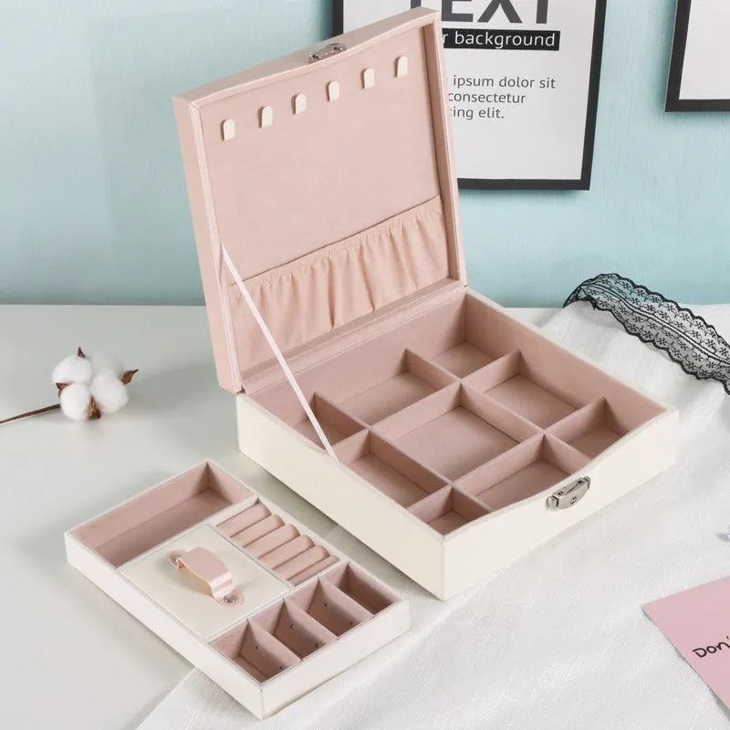 Red or white PU leather jewelry storage box with multiple compartments for necklaces and rings.
