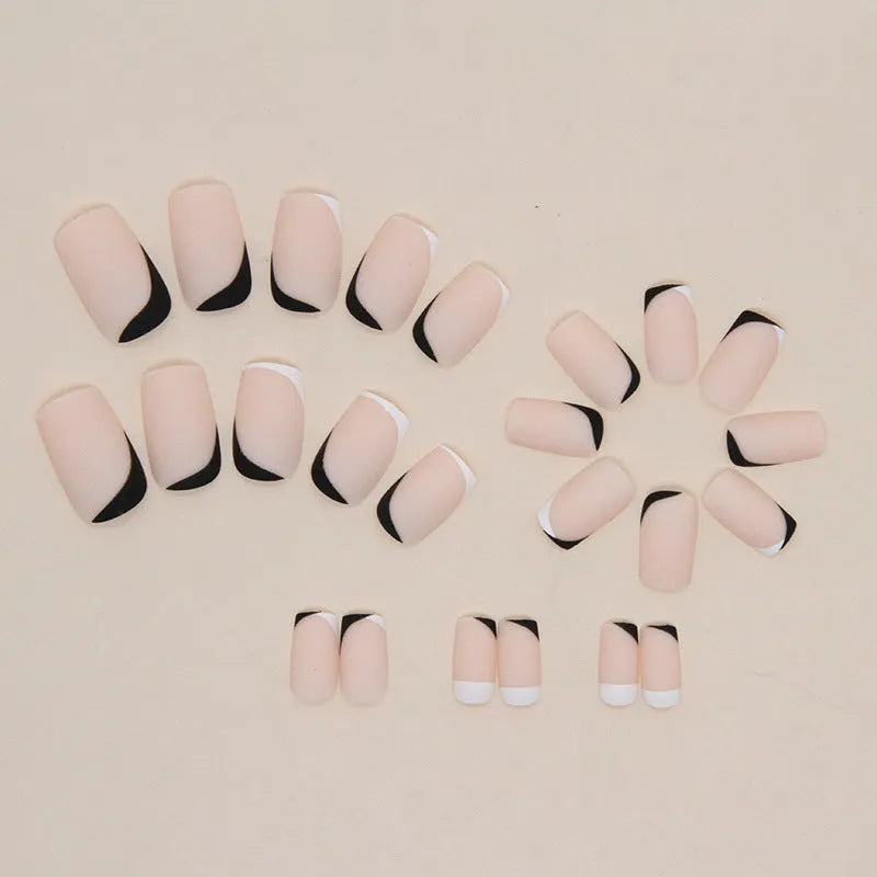 Black and white frosted false nails with Mandarin duck colour pattern and double-piece construction