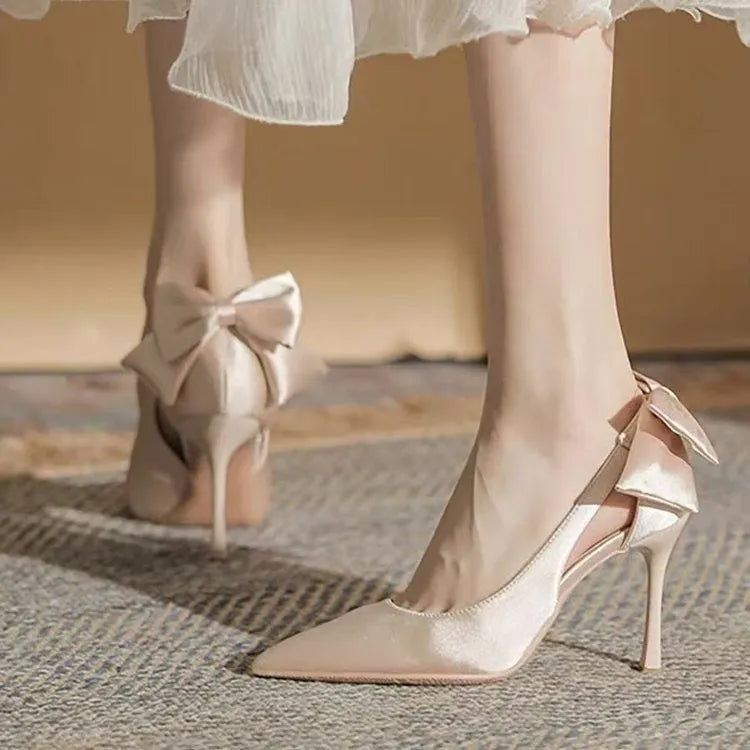 Beige satin bridal shoes with bow detail, pointed toe, and 7cm heel