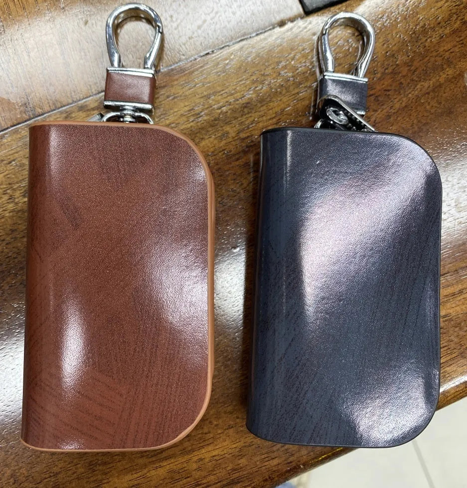 Genuine cowhide leather car key case with frosted finish showing black and brown colour options