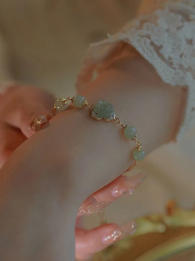 Women's bracelet with Hetian Jade Rose stone floral design and 14K gold gilding accents