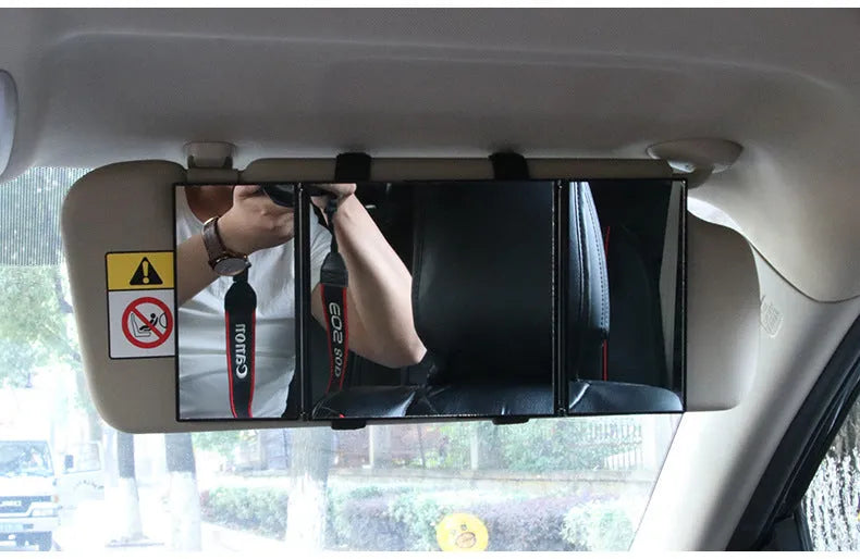 Silver car folding makeup mirror shown closed at 15.5cm and open at 30.5cm wide.
