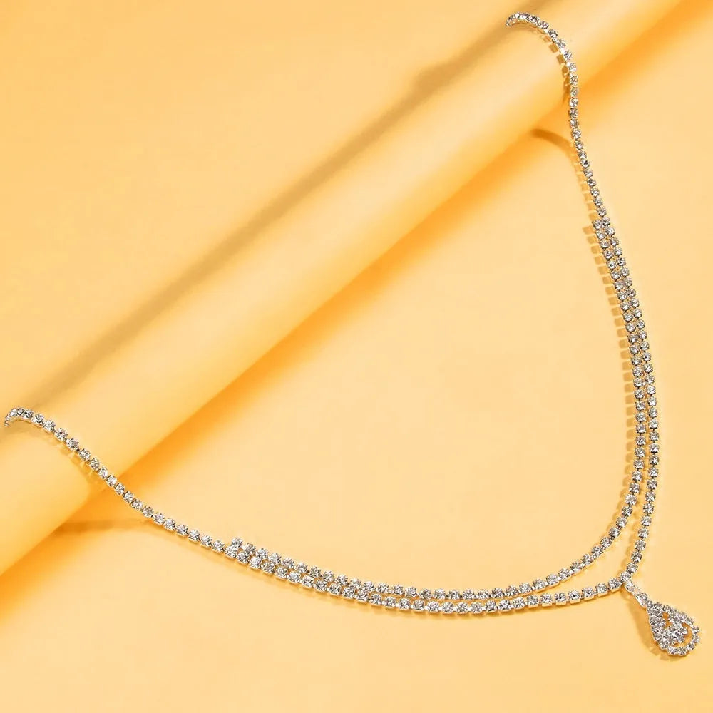 Women's water drop pendant waist chain in gold or silver colour with rhinestone decoration