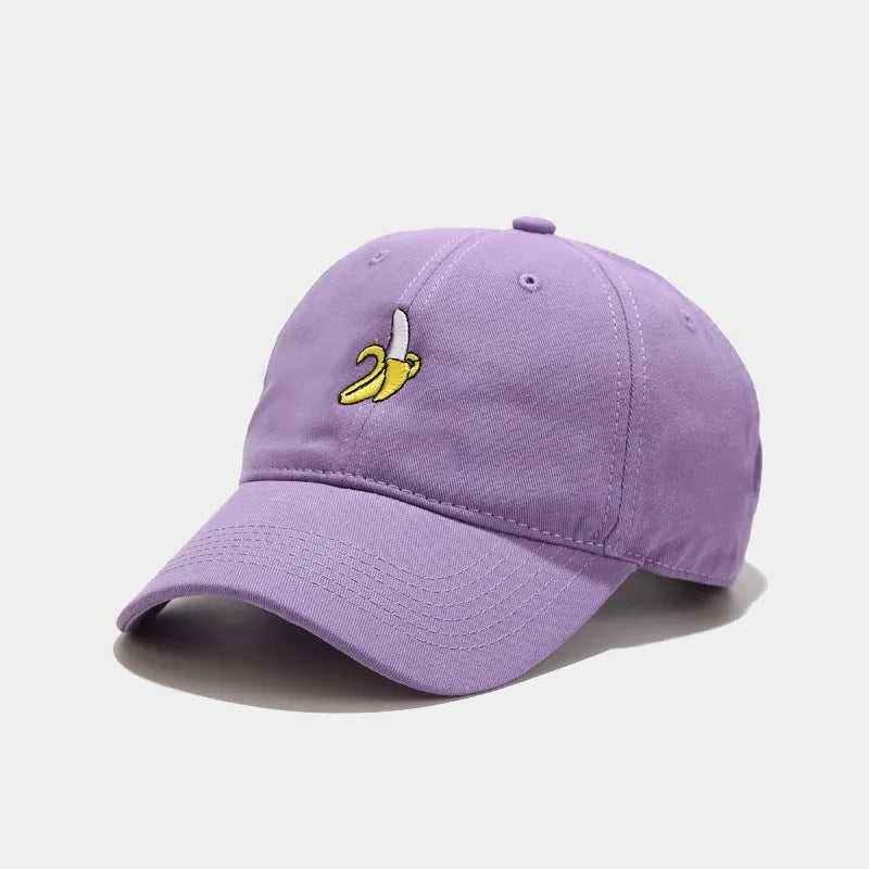 Adjustable baseball cap with cute banana embroidery in seven colour options on soft polyester fabric