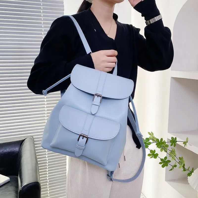 Retro college style small PU bucket bag in khaki with clamshell opening and multiple interior pockets