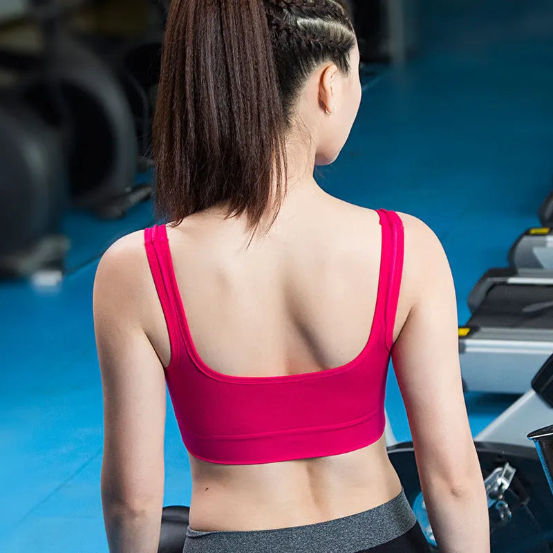 Women's reinforced shockproof sports bra with moulded cup and double straps in pink.