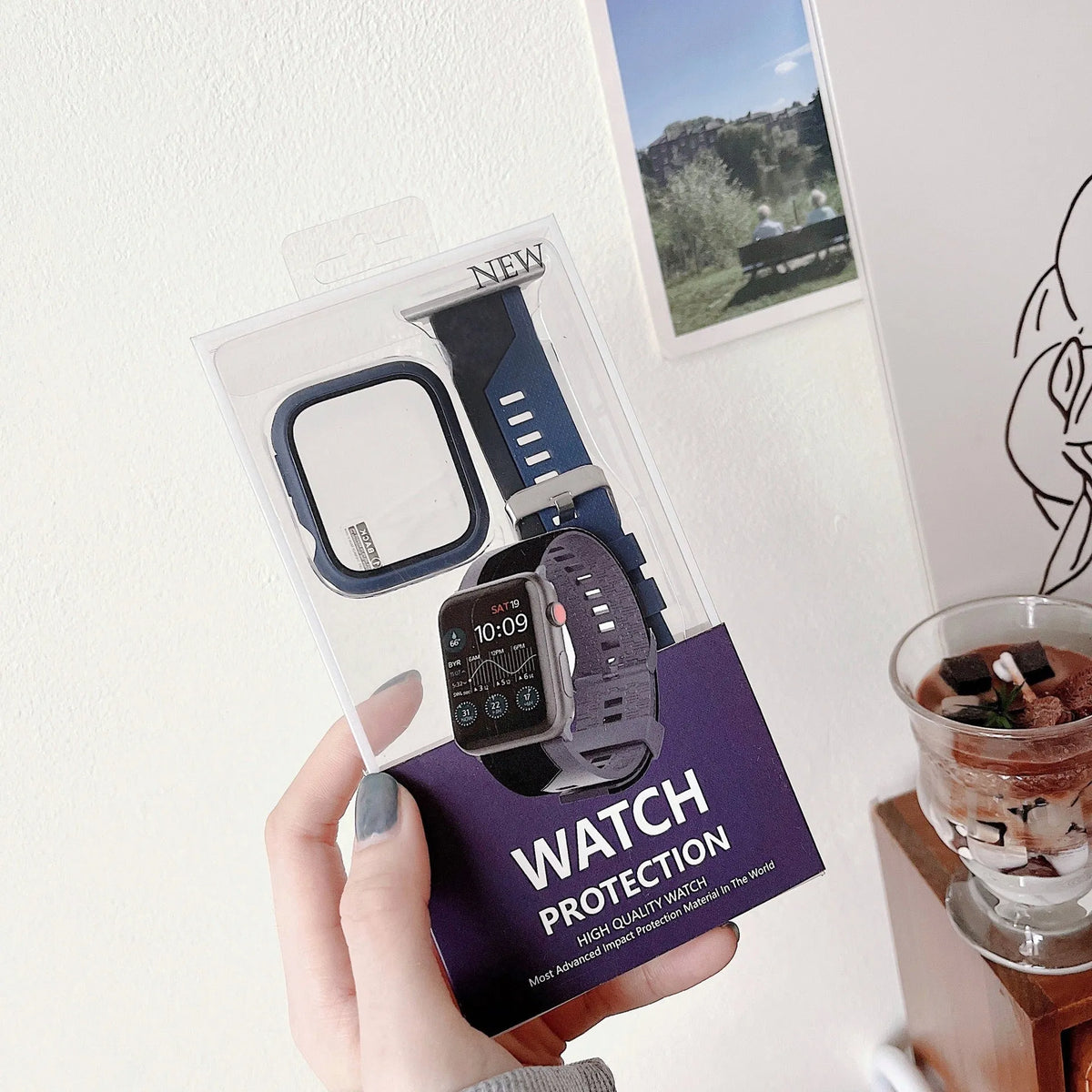 Two-tone silicone protective case for Apple Watch in black and white, fitted on a watch face