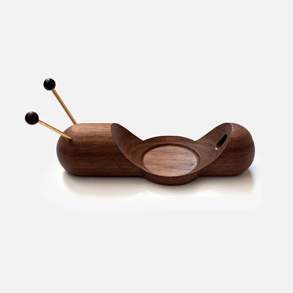 Khaki brown desktop non-slip bracket holding a smart Bluetooth speaker.