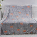 A soft flannel children's blanket with a cartoon pattern, shown in one of five available colours.