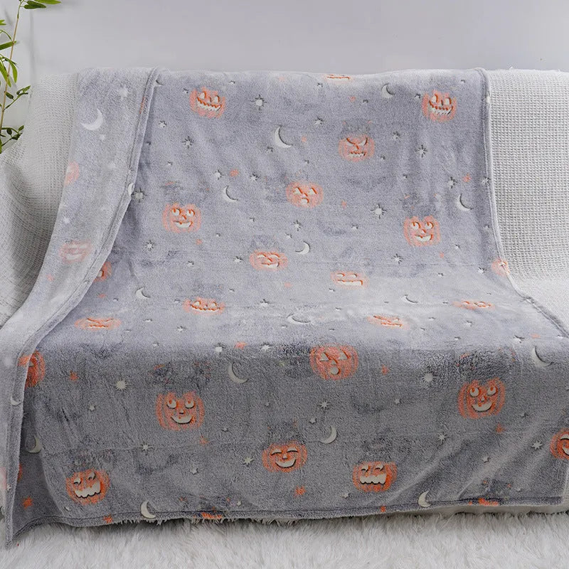 A soft flannel children's blanket with a cartoon pattern, shown in one of five available colours.