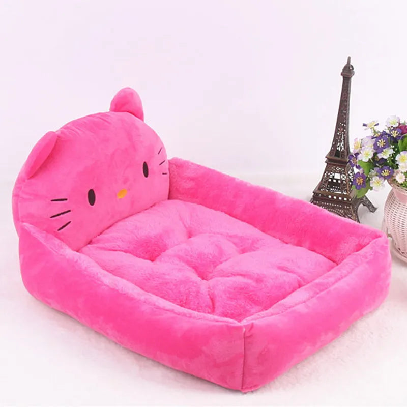 A blue cartoon-style pet sofa bed with raised sides for a small dog, showcasing its washable cover and non-slip base.