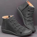 Women's casual ankle booties with a wedge heel and round toe in a selection of colours including black and leopard print.