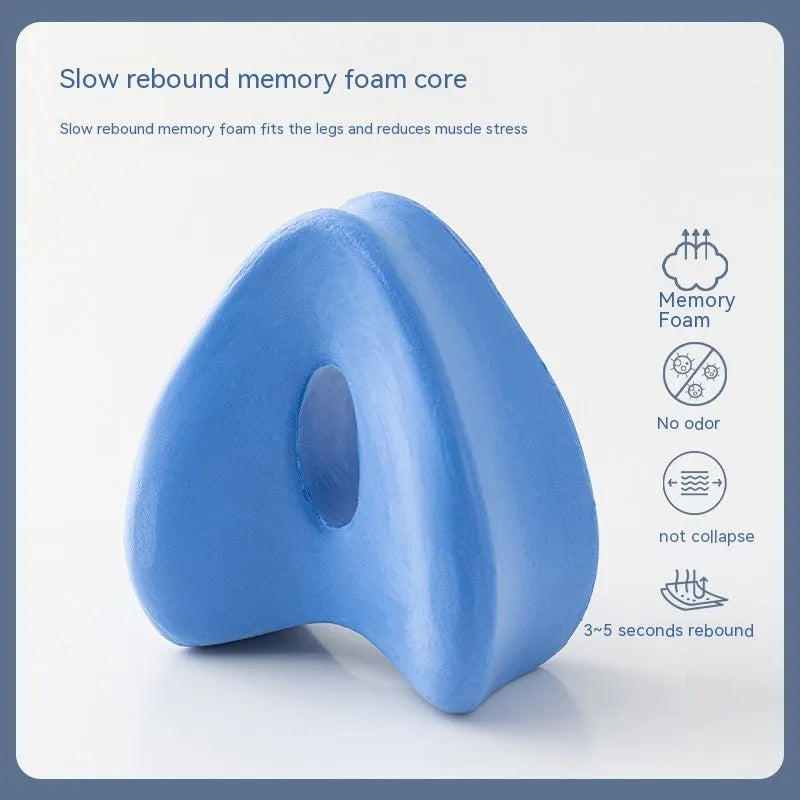Dark blue jacquard heart-shaped memory foam leg pillow for adults showing its contoured design.