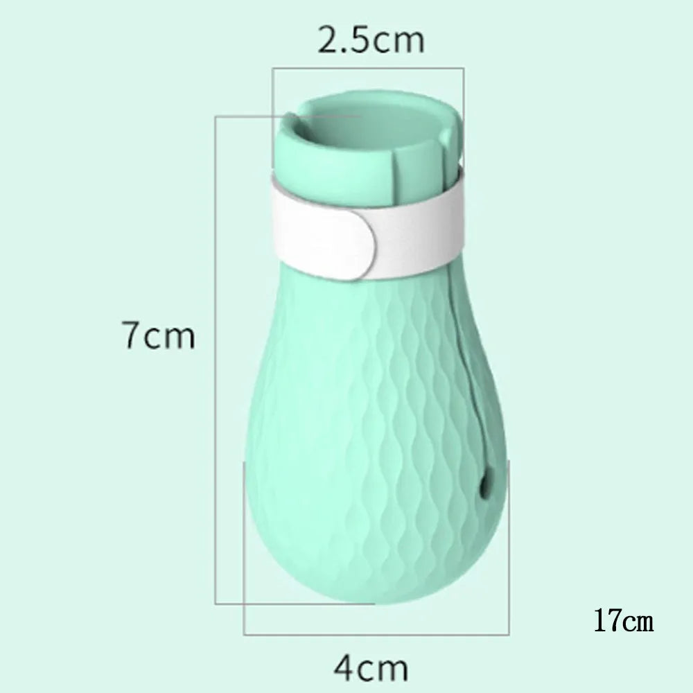 Green silicone cat anti-scratch foot covers with adjustable straps for pet handling