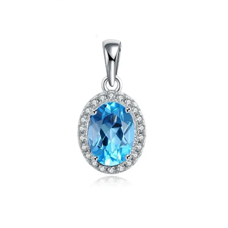 925 sterling silver jewellery set with blue topaz stones showing earrings, ring, pendant and necklace in geometric design