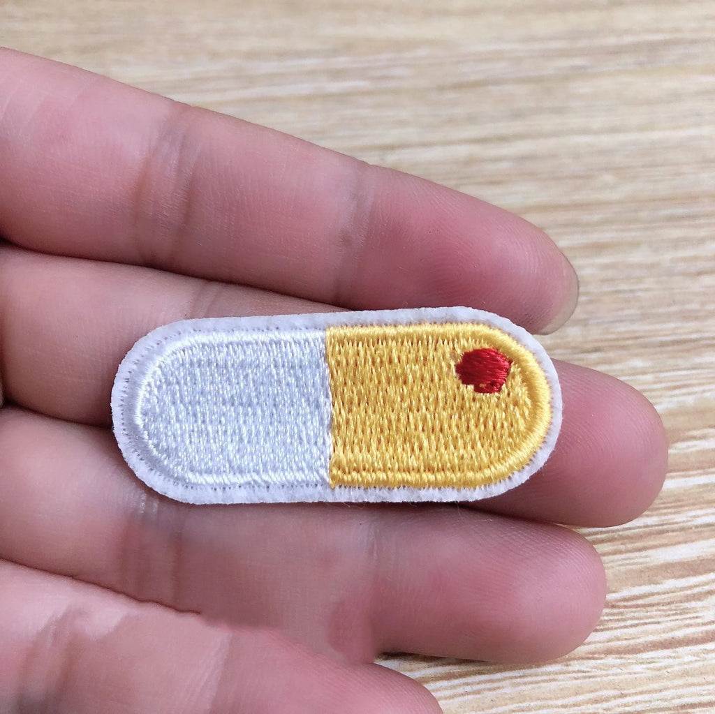 Set of ten embroidered fabric patches with four different style options for clothing decoration