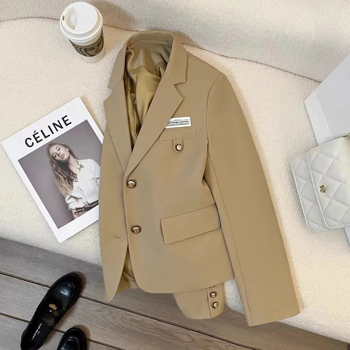 Black women's loose-fit short suit coat with long sleeves and pockets