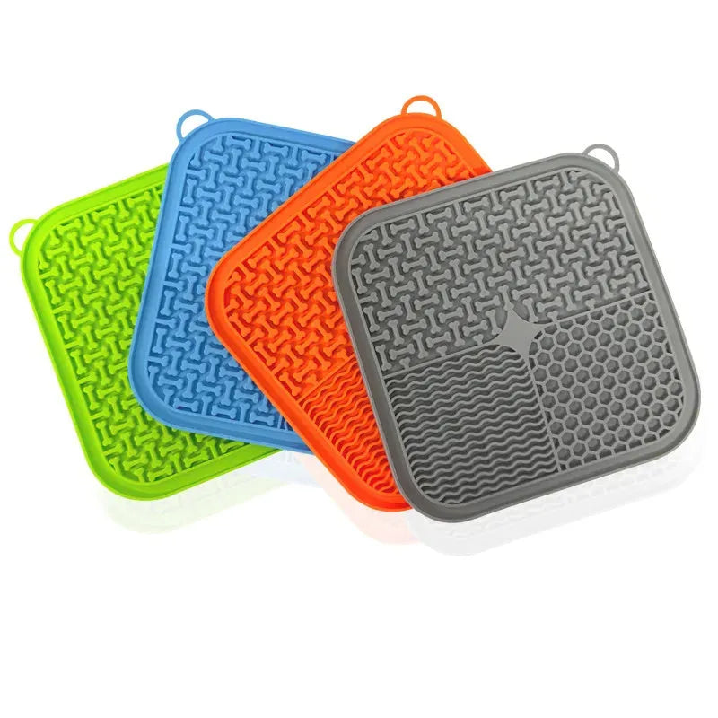 Blue silicone dog lick mat with suction cups on back, textured surface for slow feeding