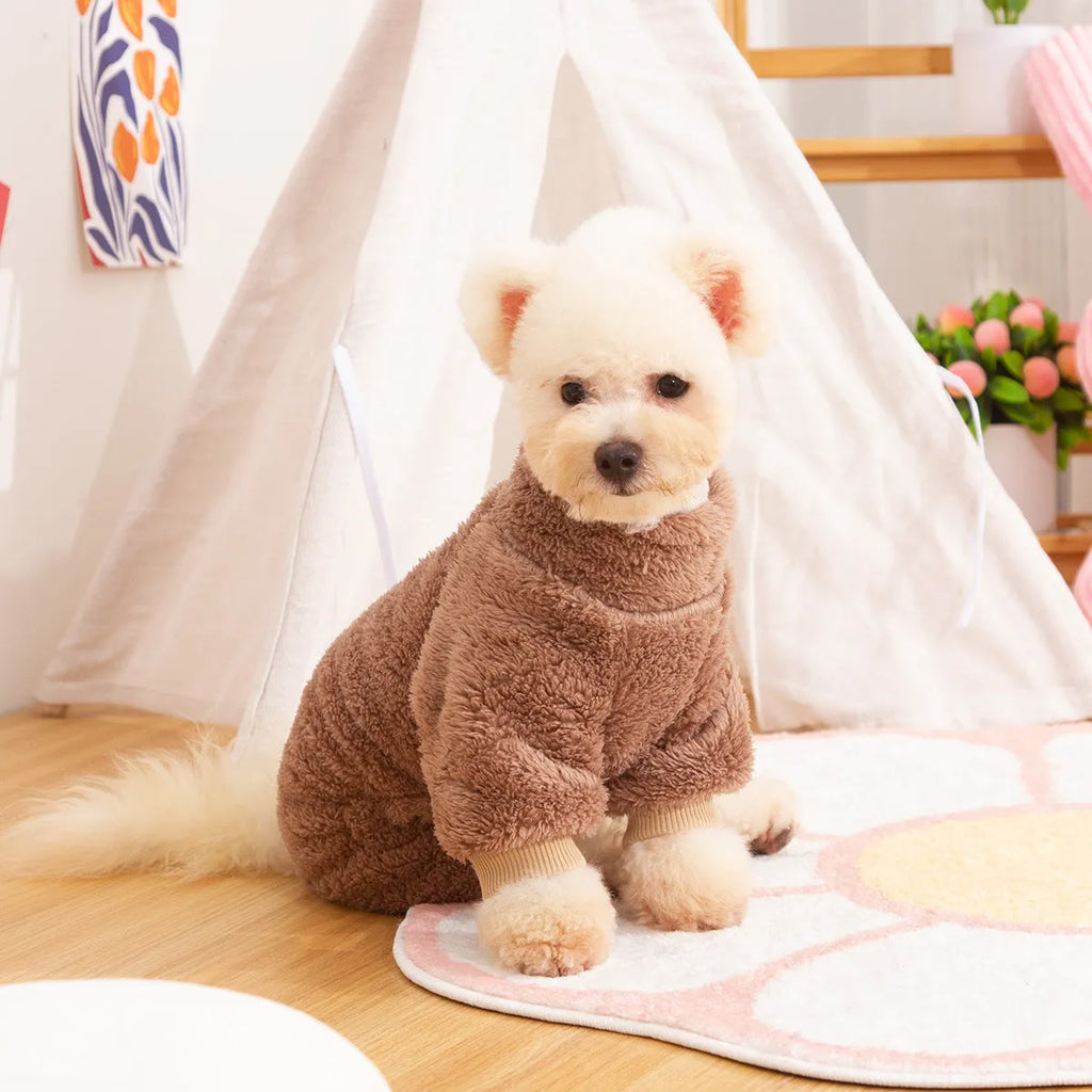Four-legged dog clothes in blue with high collar and towing ring, showing plush material and full-body coverage