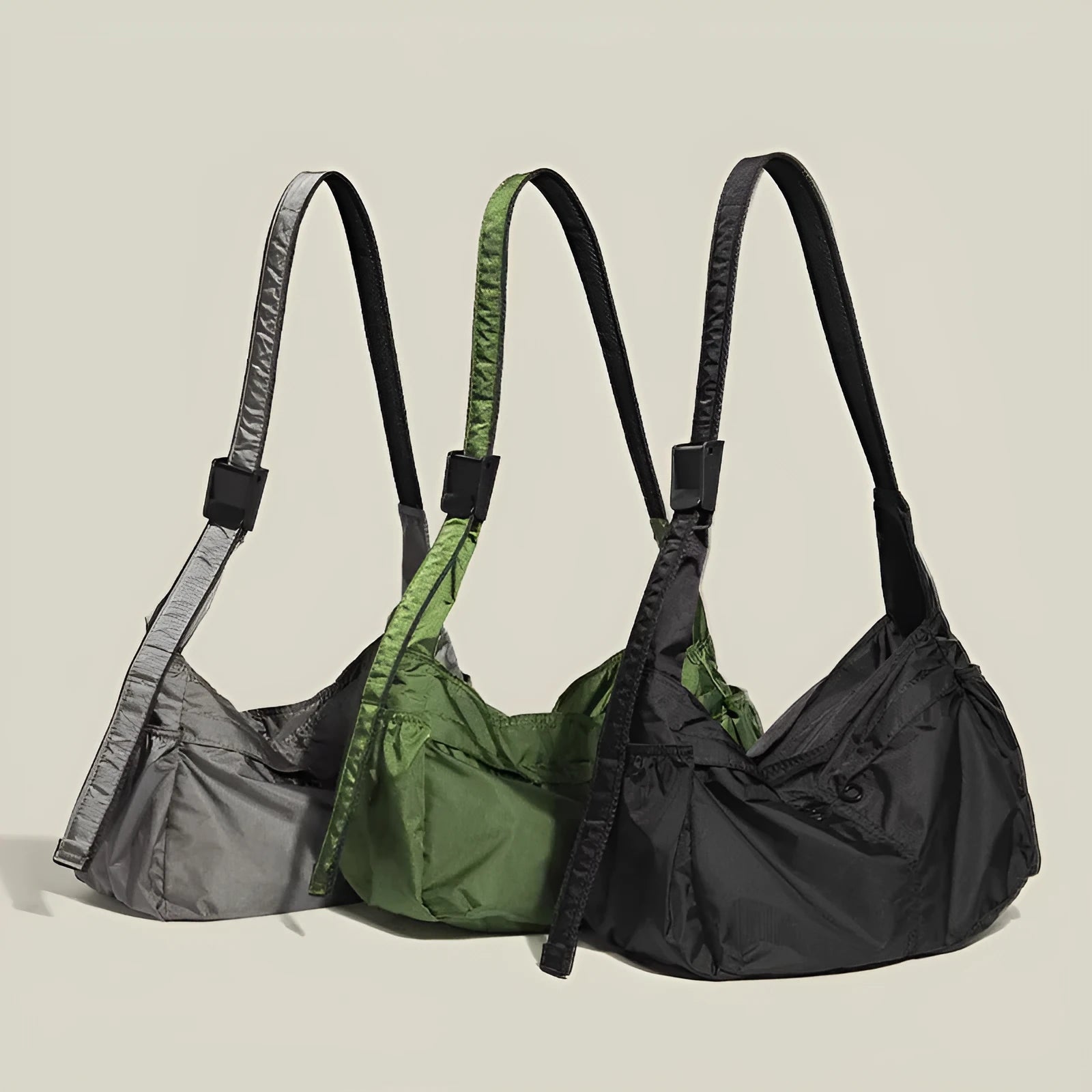 Waterproof nylon messenger bag in black colour showing horizontal square shape and shoulder strap
