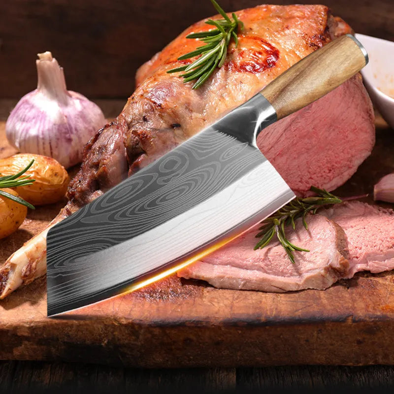 A stainless steel kitchen knife with a 320mm blade on a cutting board.