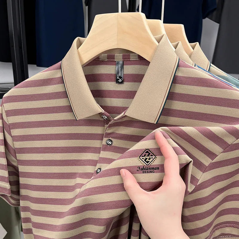 A man wearing a red striped short sleeve casual shirt with a mosaic pattern detail.