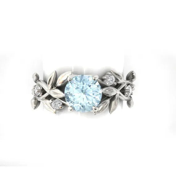 Zircon leaf engagement ring in electroplated metal, available in five colours and sizes 6 to 11