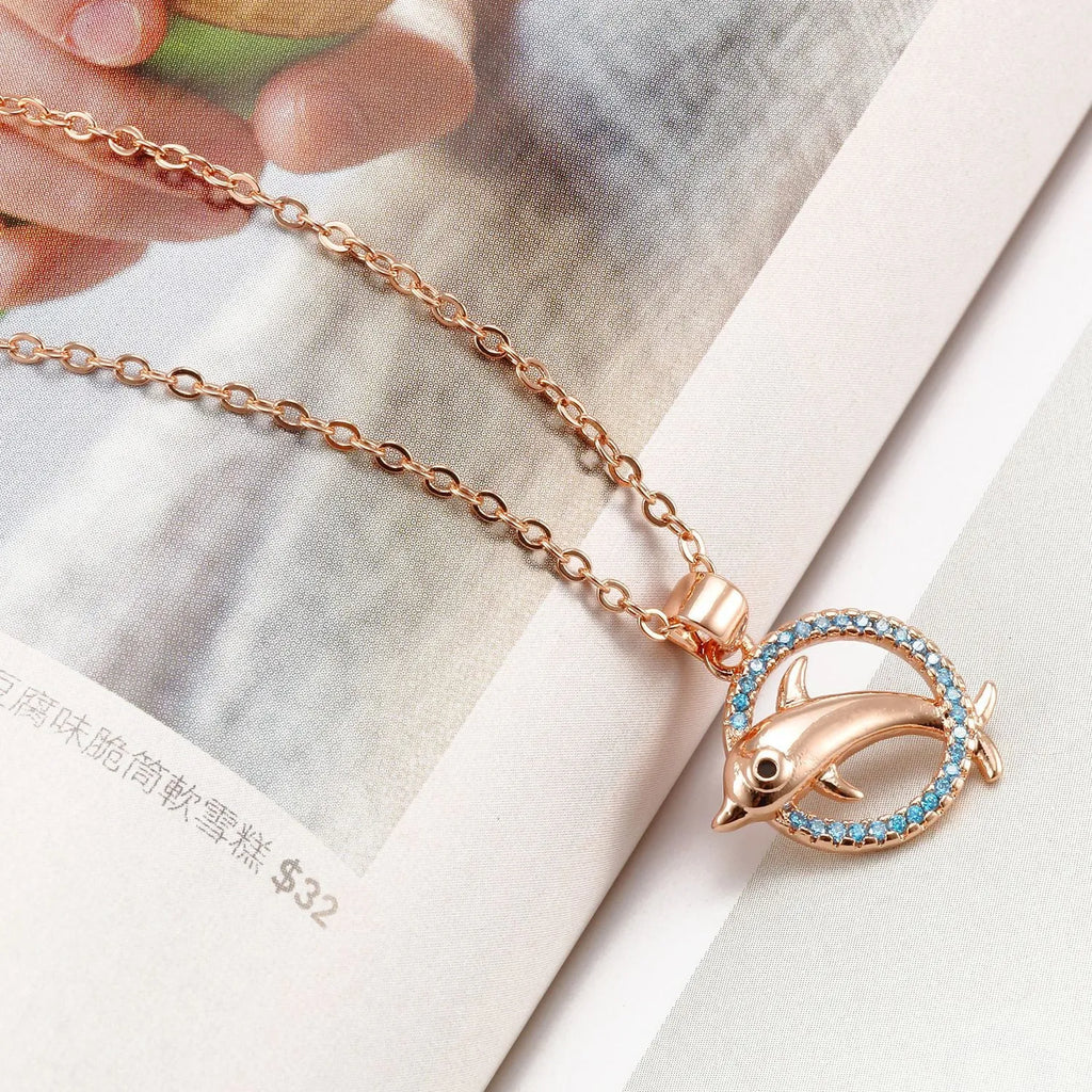 Romantic dolphin copper pendant necklace available in rose gold and silver finishes