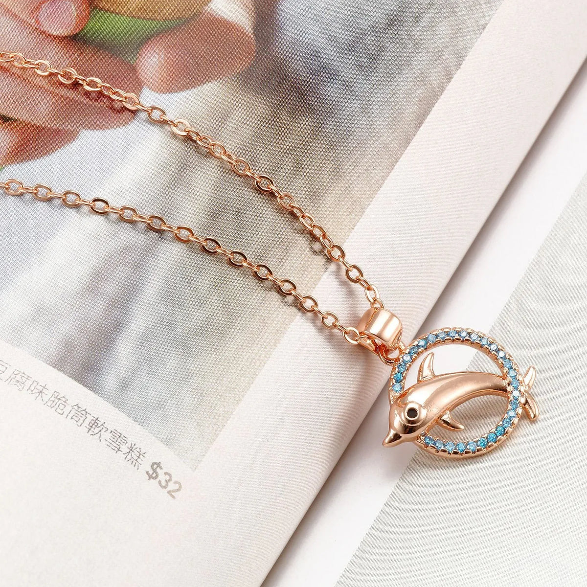 Romantic dolphin copper pendant necklace available in rose gold and silver finishes