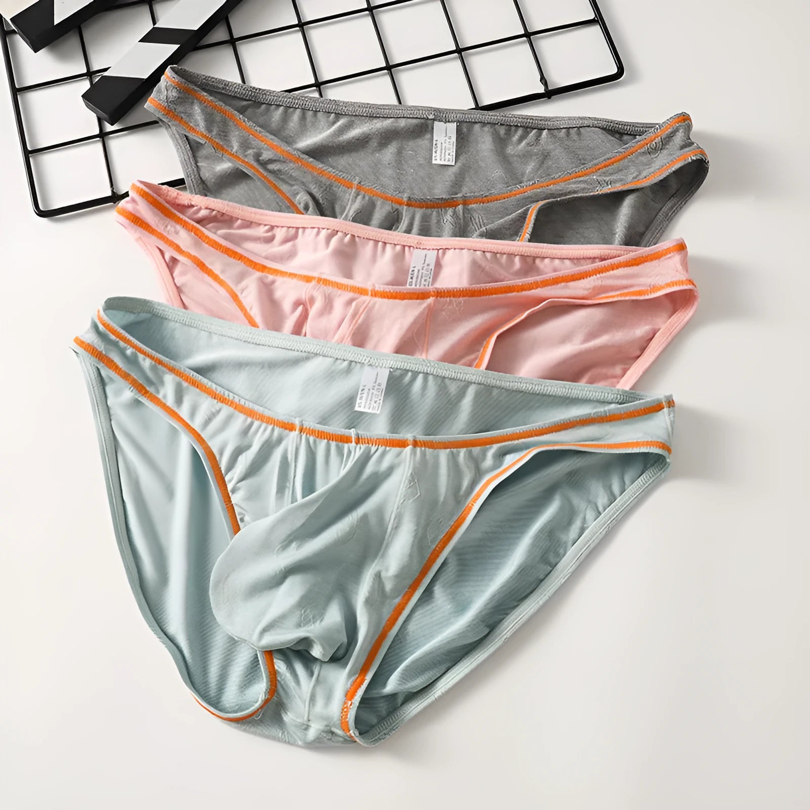Men's modal hip-lift underwear in dark grey, shown flat.