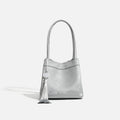 PU leather shoulder crossbody bag with single strap, tassel, open pocket, and sewing thread detail