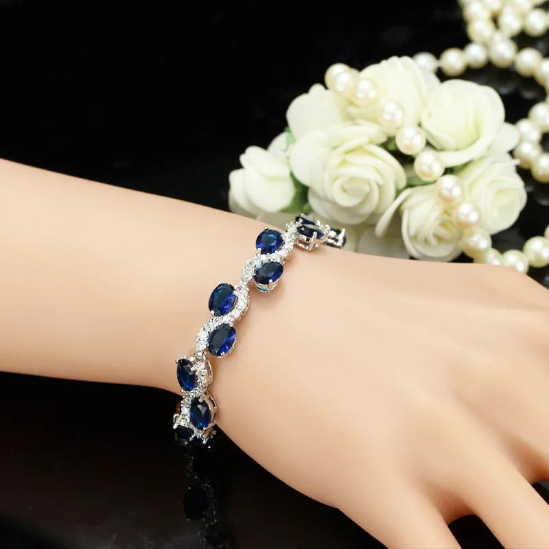 Copper-plated gold bracelet with zircon inlay showing geometric design and adjustable 18.4 cm length
