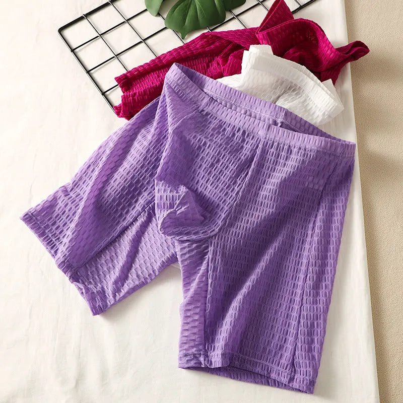 Men's solid colour lace boxer shorts on a white background, showing shaping design.