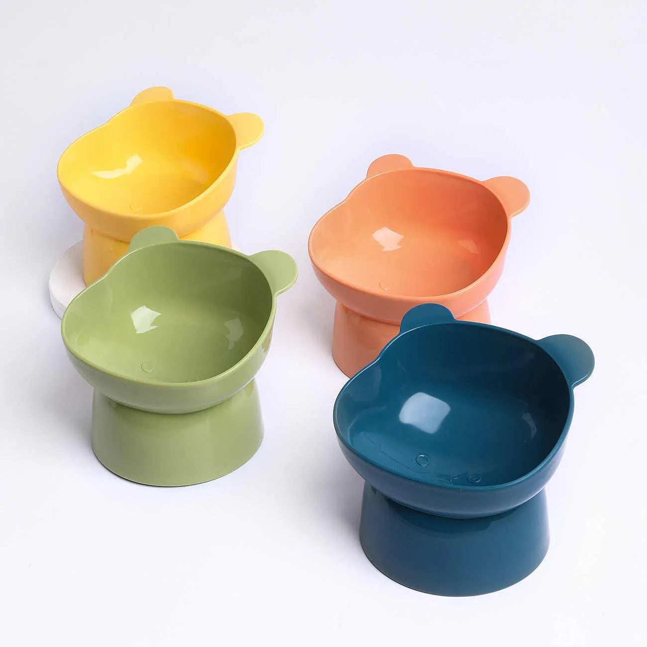 Oblique high foot anti-tumble PP plastic pet bowl for cats and dogs in four colours