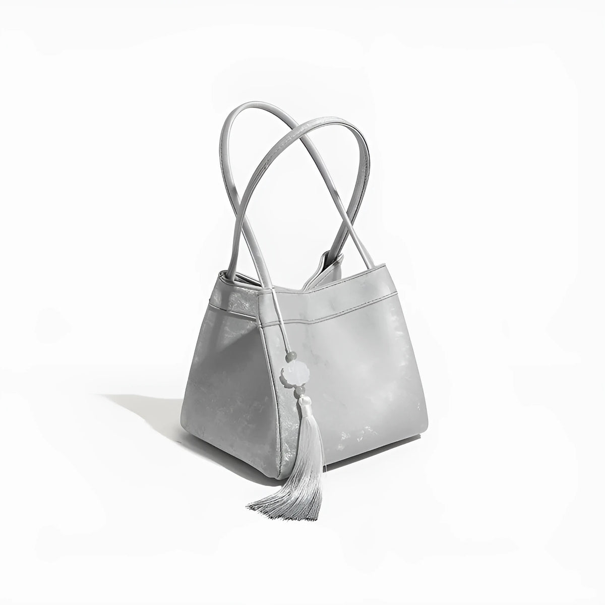 PU leather shoulder crossbody bag with single strap, tassel, open pocket, and sewing thread detail