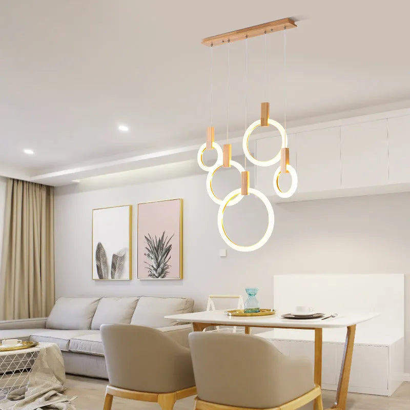 White wooden LED chandelier with three ring sizes 200 300 and 400mm on fishing line suspension for living room